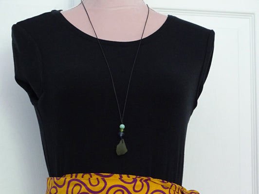 Green sea glass pendant with beads