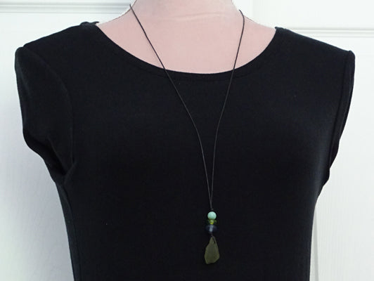 Green sea glass pendant with beads