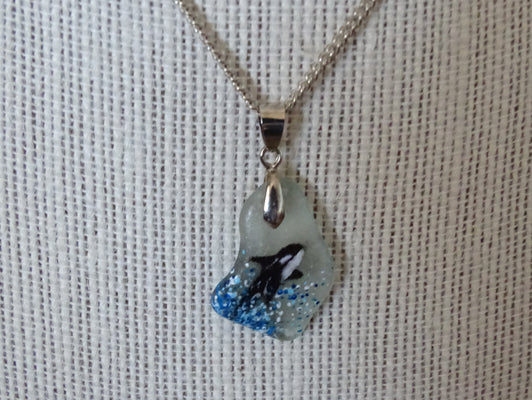 Orca painted on green sea glass pendant