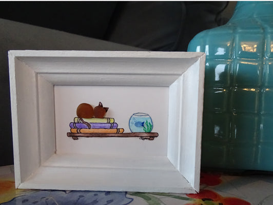 Sea glass cat with books and fish