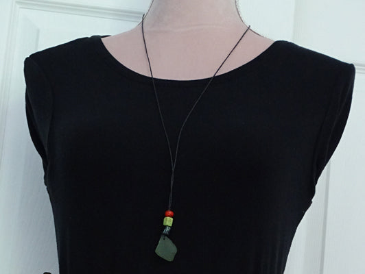 Green sea glass pendant with 3 beads