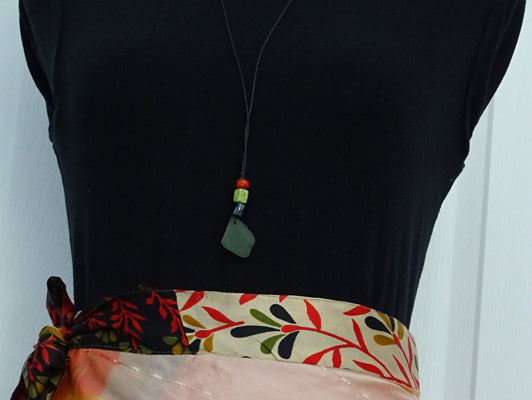 Green sea glass pendant with 3 beads