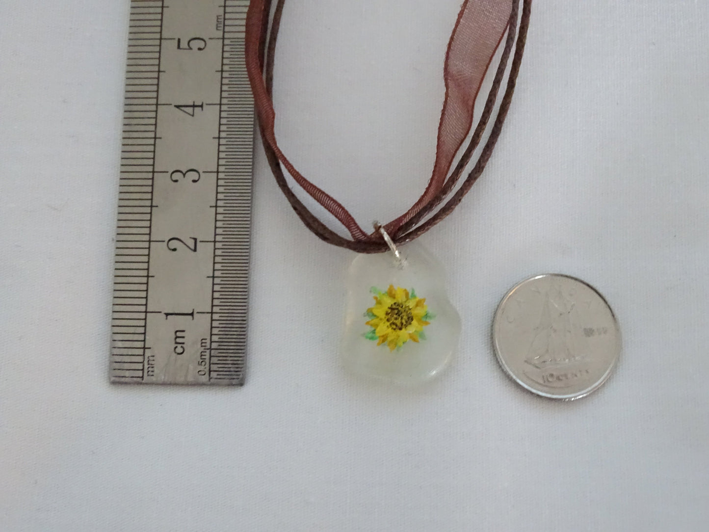 Sunflower painted on sea glass pendant