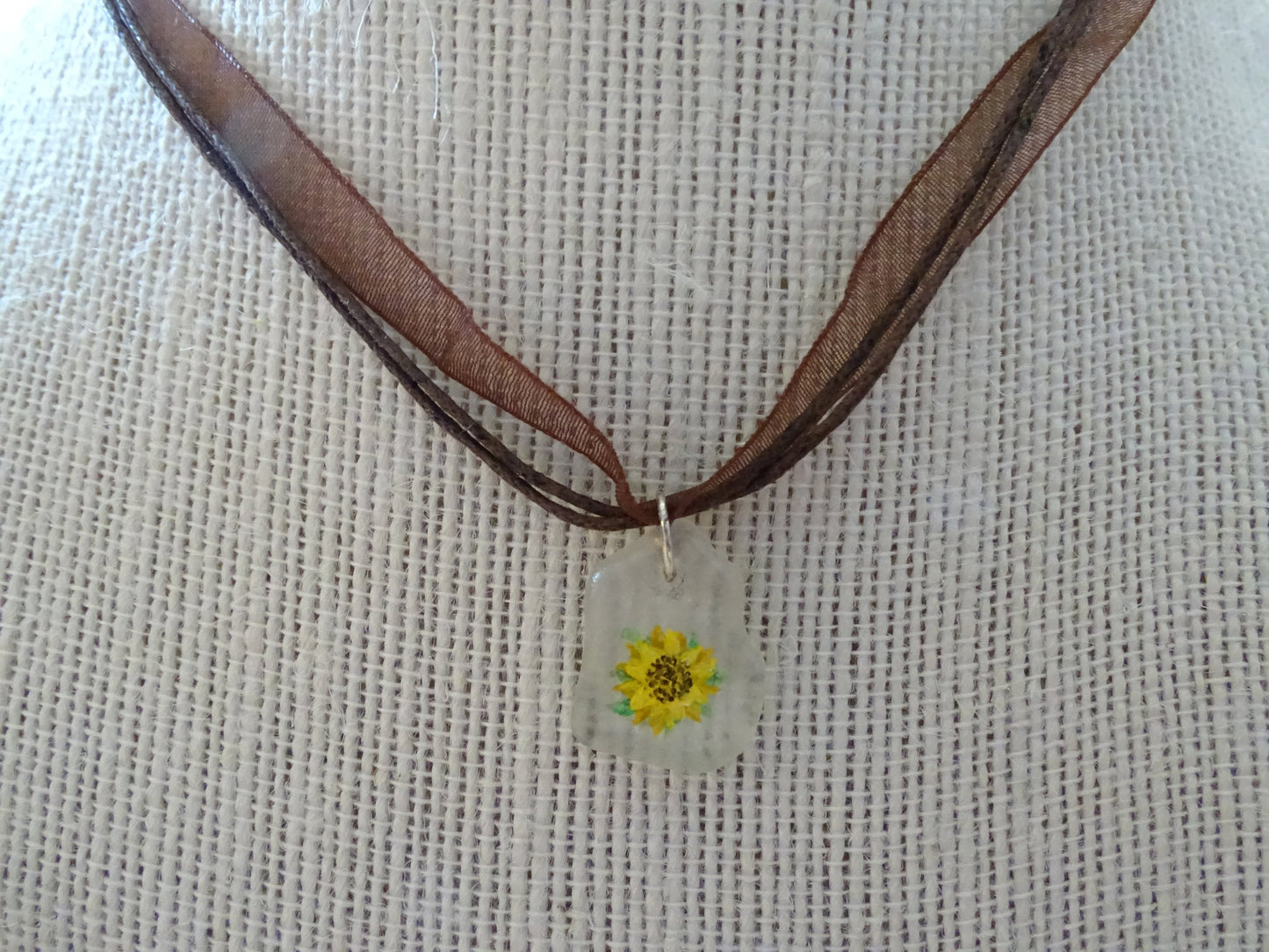 Sunflower painted on sea glass pendant