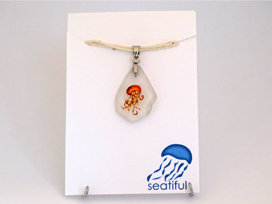 Orange jellyfish painted on sea glass